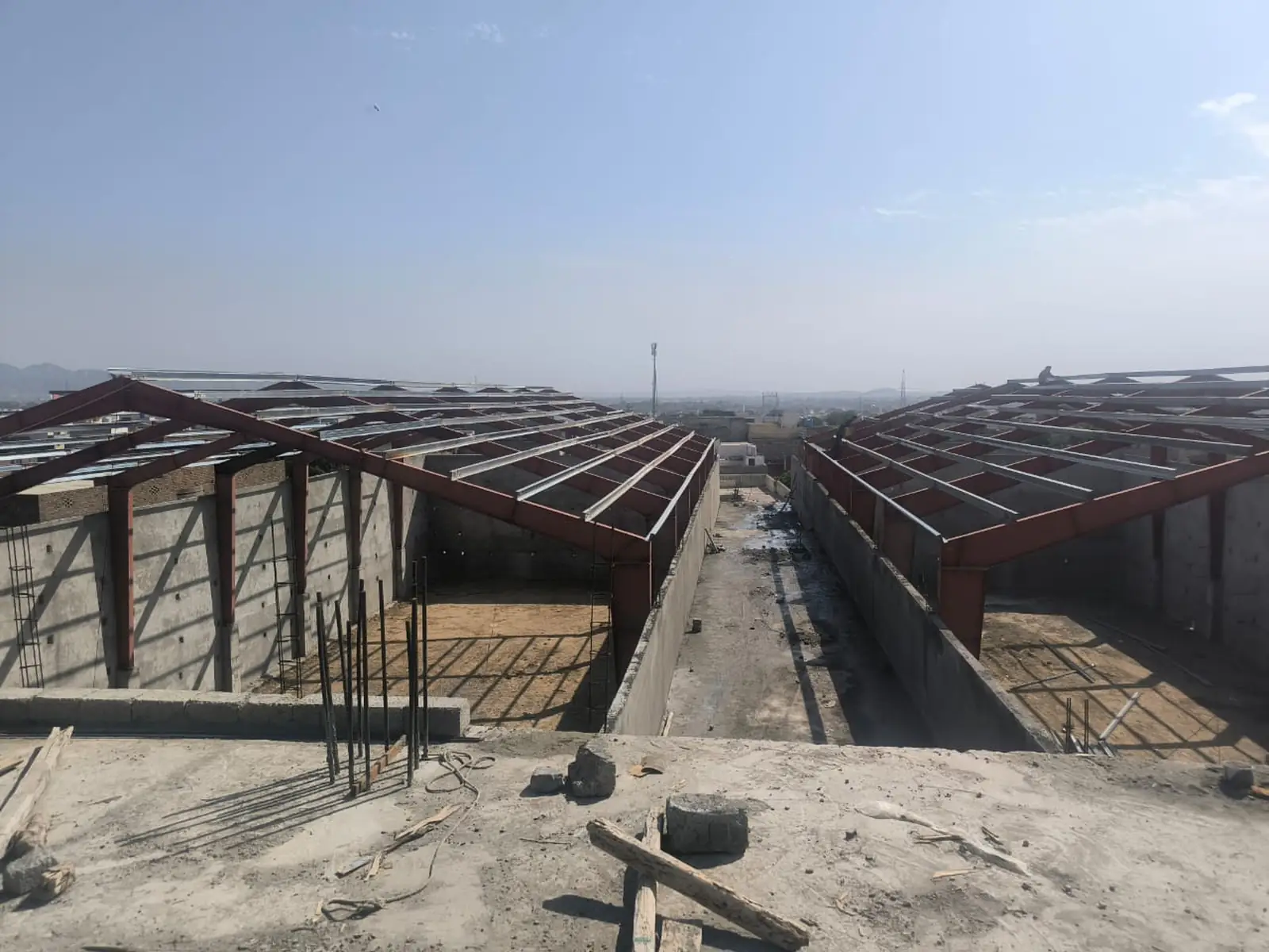 Aerial view of steel roof frame over industrial shed buildings, commercial building contractors Islamabad